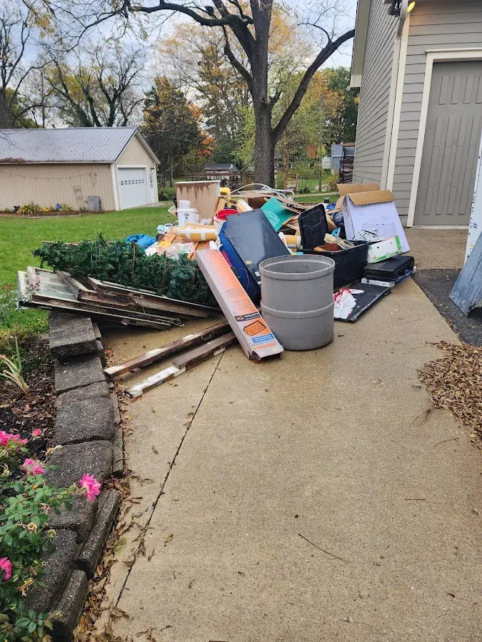 Dumpster being loaded with debris for 3 Yard Dumpster Rental in Monrovia